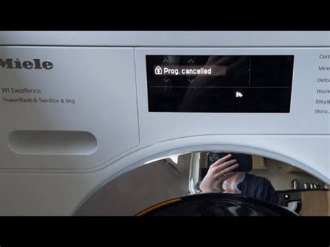 how do you cancel a program on miele w1 washing machine
