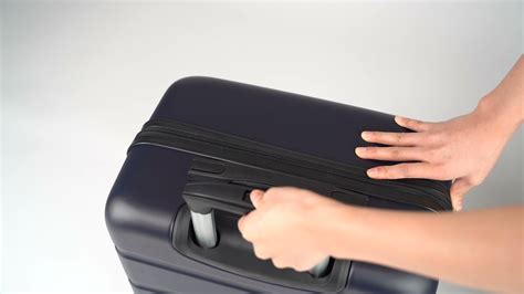 how to fix suitcase handle button without screwdriver