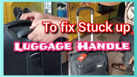 how to fix suitcase handle stuck