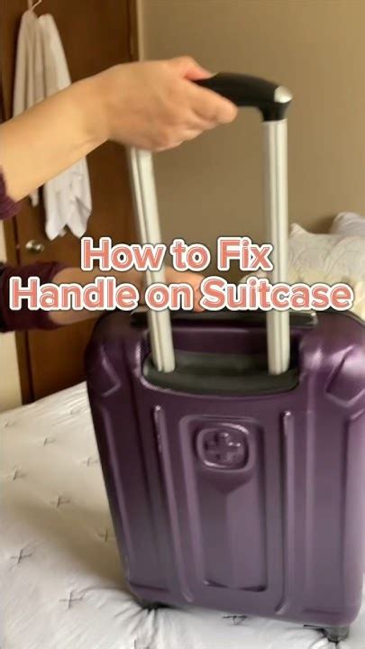 how to fix suitcase handle that won't go down