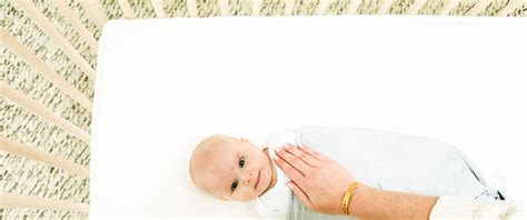 how to get my newborn to sleep in his crib