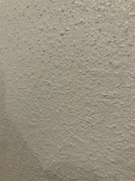 how to get rid of popcorn textured walls