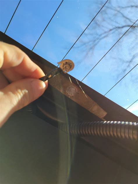 how to reattach rear defroster tab
