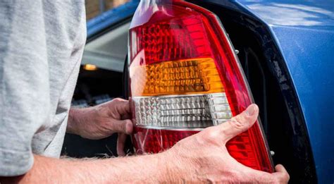 how to remove broken tail light bulb