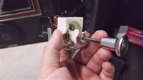 how to remove headlight switch knob