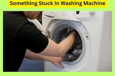 how to remove something stuck in washing machine drum front loader