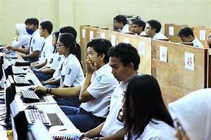 Indonesian students focusing on an exam