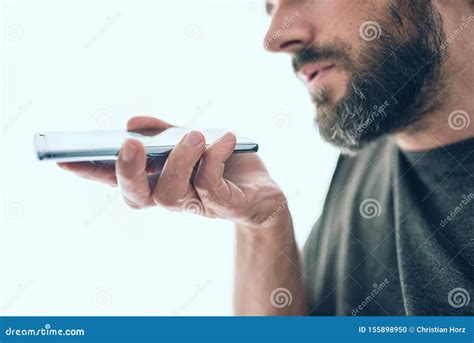man recording voice message on phone
