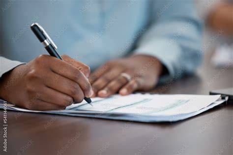 Man signing report document