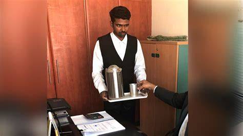 office boy serving coffee