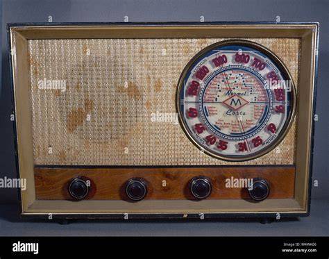 An old radio receiver with a large dial and various buttons