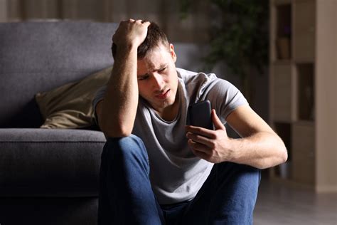 Person checking phone anxiously