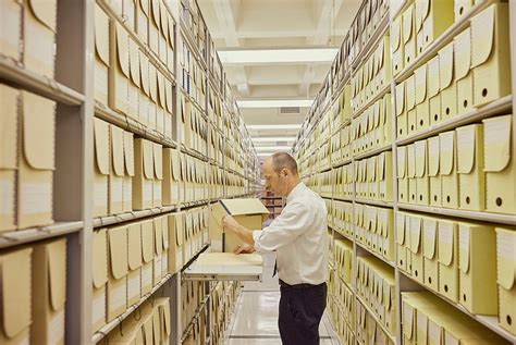 A person studying archival documents