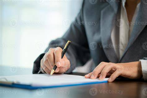 A person writing on a document