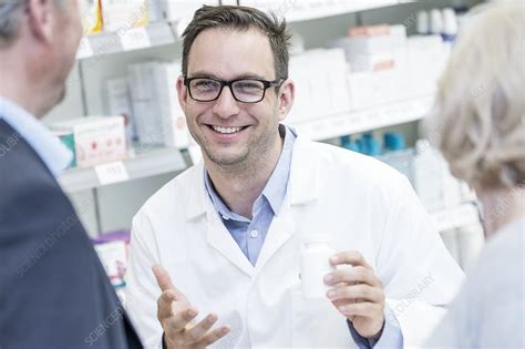 Pharmacist explaining medication to patient
