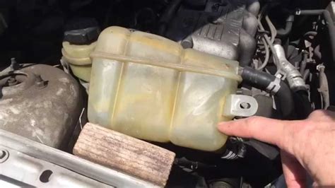 radiator overflow tank leaking