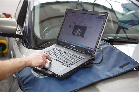 reprogram powertrain control module cost