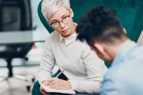 researcher interviewing a person