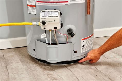 rheem hot water heater leaking from overflow pipe