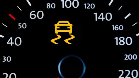 what causes traction control light to come on while
