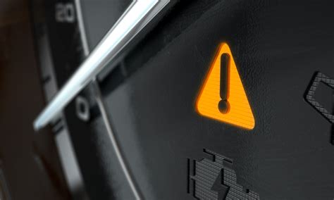 what does a triangle with an exclamation mark mean on a car dashboard