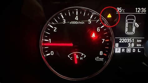 what does a yellow triangle on dashboard mean