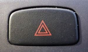 what does the red triangle button mean in a car