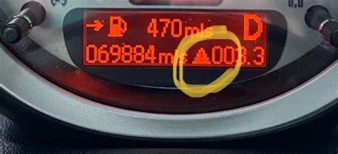 what does the triangle with exclamation point mean in a mini cooper