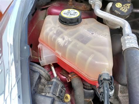 what is a coolant overflow reservoir
