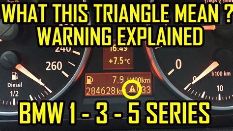 what is the yellow triangle warning light on dashboard