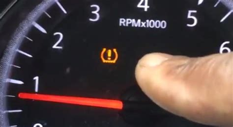 where is the tpms reset button on a nissan rogue