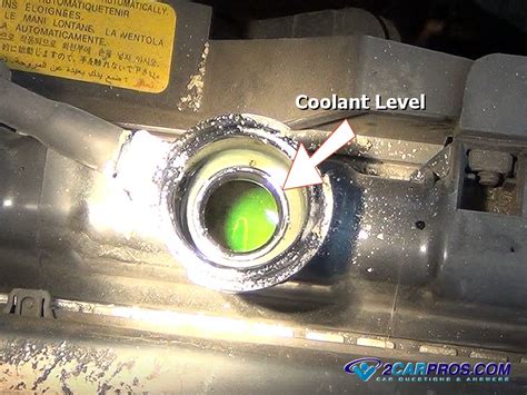 where should coolant level be in radiator when cold