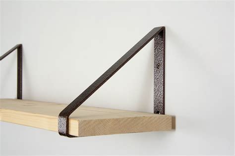 which side of a shelf bracket goes on the wall