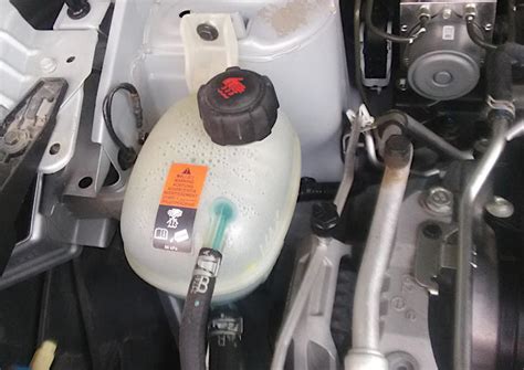 why does my low coolant light came on when it's full