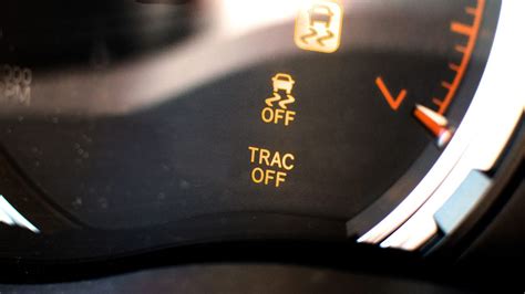 why is my trac off and engine light on